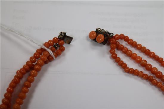 A triple strand graduated coral bead necklace, gross weight 51 grams, 50cm.